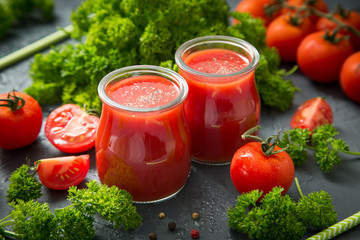 fresh organic tomatoes and tomato juice with parsley. the detox