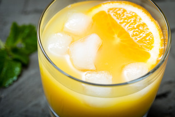 Orange juice in glass with mint, fresh fruits. selective focus,