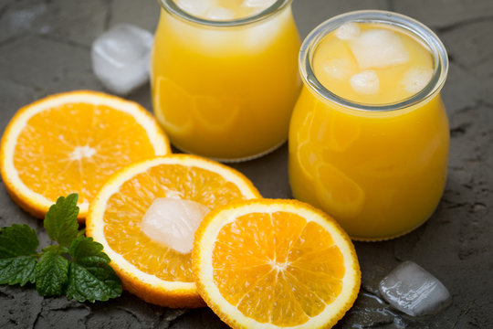 Orange juice in glass with mint, fresh fruits. selective focus,