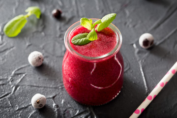 red smoothie with frozen berries, selective focus, top view. detox koncept