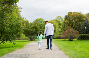happy family walking in summer park