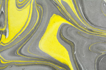 Naklejka premium Abstract background. Ink marbling texture. Grey, yellow and white. Hand drawn marble illustration, ebru aqua paper and silk print. Traditional Turkish ebru technique. Painting on water. 