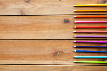 Obraz premium close up of crayons or color pencils on wood