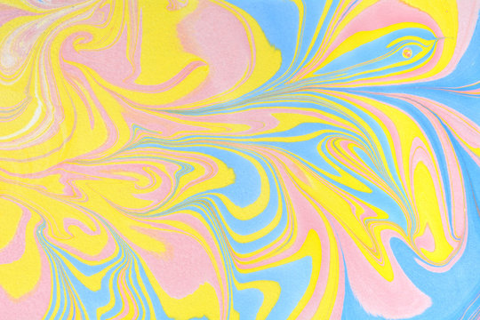 Abstract handmade marble background. Ebru, traditional Turkish painting art. Painting on water. Transferred painting on paper. Marbling style. Writing surface, endpapers in bookbinding and stationery.