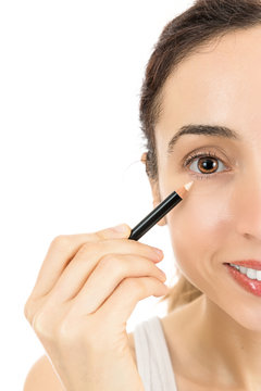 Close up caucasian woman applying eyeliner