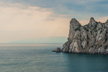 Fototapeta na wymiar Peaked rock in sea