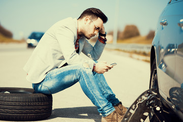 Man with car trouble in the middle of the street