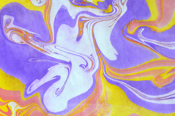 Close up view of an original ebru painting. Abstract bright grunge background. Multicolored paper texture with space for text or image. Fragment of artwork, modern art, contemporary art. Turkish art.