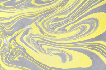 Creative ebru background with abstract acrylic painted waves. Beautiful marbling texture. Handmade marble surface.