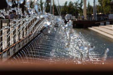 Fototapeta na wymiar Fountain: Water flowing Out From Multiple Pipes