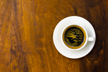 coffee cup on wooden table ,soft focus