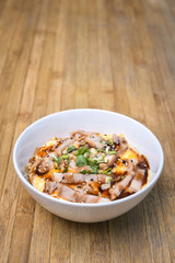 Traditional Japanese food, Oyakodon and rice in a bowl. (Chicken