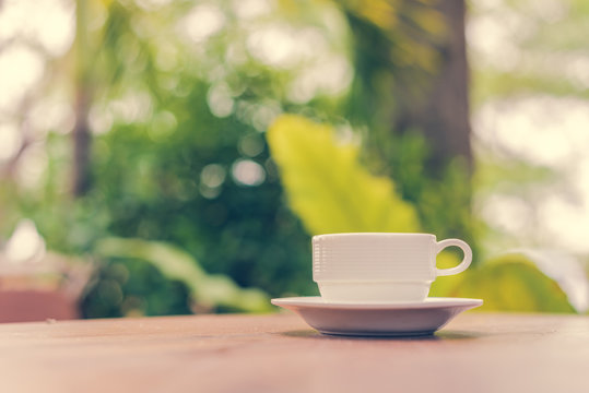coffee cup on wooden table ,soft focus