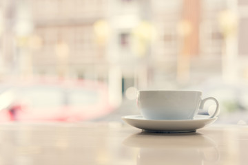 coffee cup on wooden table ,soft focus