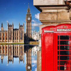 Fototapeta na wymiar London symbols with BIG BEN and red PHONE BOOTHS in England, UK