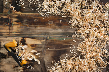 Wood chips and jointer on old wooden board