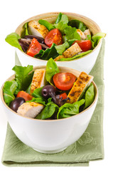 Fried chicken salad with cherry tomatoes and black olives