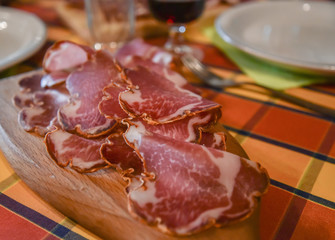 Cured Meats served on a wooden board in an agriturismo in Basilicata, Italy