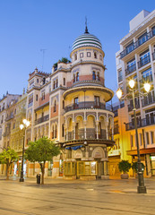 SEVILLE, SPAIN - OCTOBER 29, 2014:  The building in the neo-mudejar style on Avenida de la Constitucion street in morning dusk.