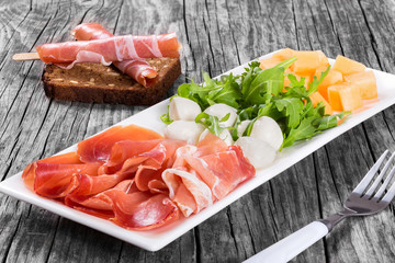 Arugula, prosciutto, mozzarella and melon  salad , top view