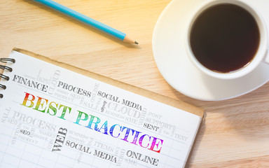 Concept BEST PRACTICE message on book. A pencil and a glass coffee table.Vintage tone.