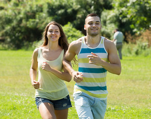 friends jogging on summer