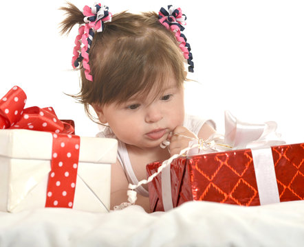 Cute baby girl  with gifts