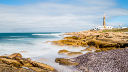 Lighthouse from Uruguay in Cabo Polonio Long-exposure beach waves walk - obrazy, fototapety, plakaty