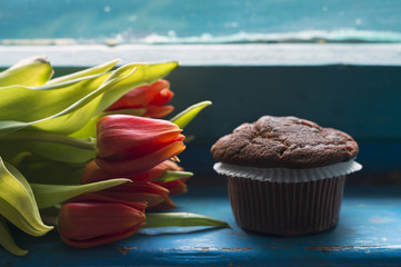 Chocolate chip muffin and tulips 
