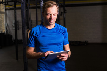 Personal trainer using tablet