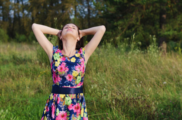 Summer portrait of beautiful woman on nature background