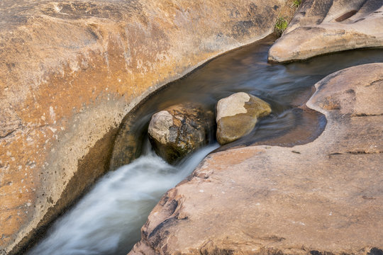 small creek flowing over sandstone