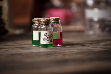 alchemist table with various poisons