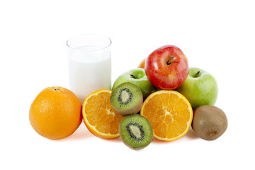 glass of milk and assorted fruits