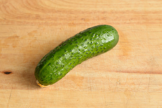 Green cucumber on wooden.