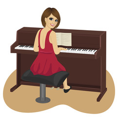 young woman playing brown upright piano looking over shoulder