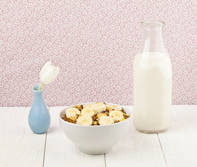 cereals with banana and milk on the side