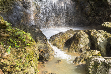 Tall waterfall floating inside water pool, Indonesia