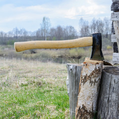 Axe in a log