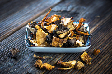 Dried mushroom on wood background