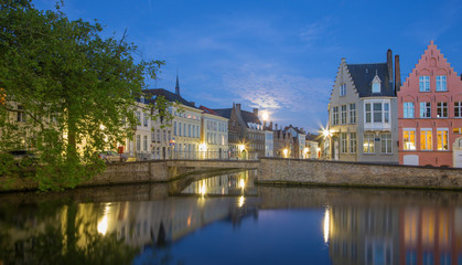 Fototapeta na wymiar Bruges - Canal and st. Annarei and Verversdijk streets in evening dusk.