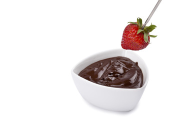 strawberry dip on a bowl with chocolate syrup