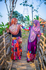 Muslim woman playing on paddy field in a village at Indonesia