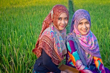 Muslim woman playing on paddy field in a village at Indonesia