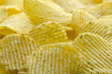 Potato chips striped with greens