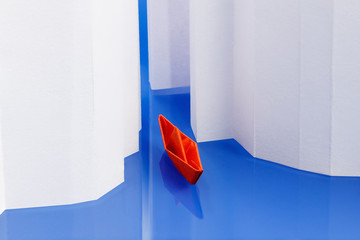 Concept of success, moving forward. Origami paper boat on water as an icebreaker - obrazy, fototapety, plakaty