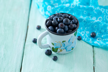 blueberry on wooden surface
