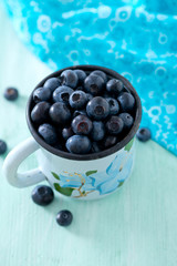 blueberry on wooden surface