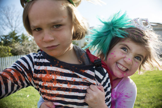 Children in costumes playing outdoors