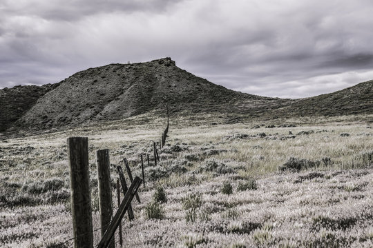 Fence and mountains, Bridger, Montana, USA